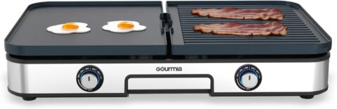 Gourmia GEG1430 3-in-1 indoor grill and griddle electric combo cooking breakfast foods and grilled meats on a kitchen countertop.